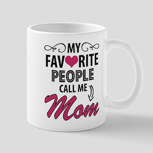 White mug with text 'My favorite people call me Mom' on a light gray background